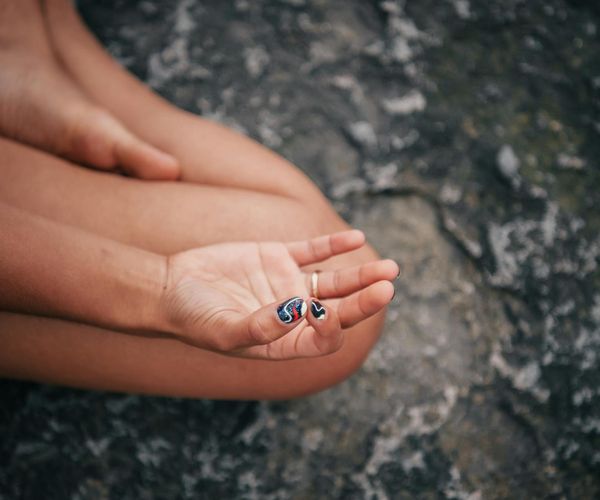 Close up of hands in mudra position during meditation